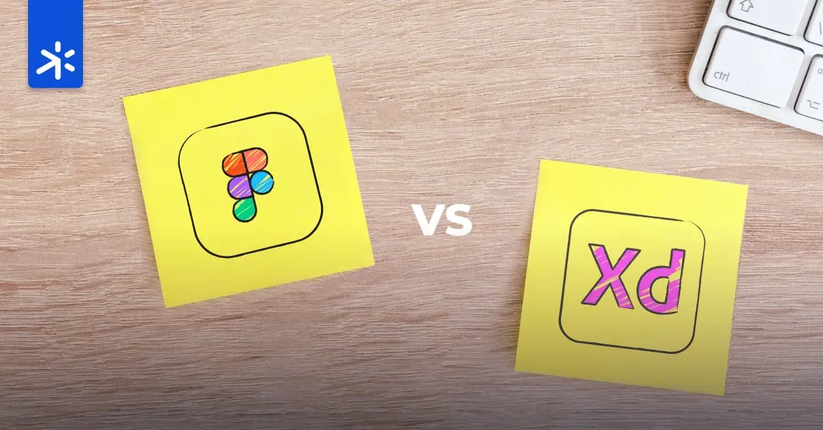 15-SPX-BlogPost-110623-4 A desk with two yellow post-it notes featuring hand-drawn Figma and Adobe XD logos in pen and color. The background is a light wood color, with a glimpse of a white keyboard on the top right and the SparxWorks logo on the top left.